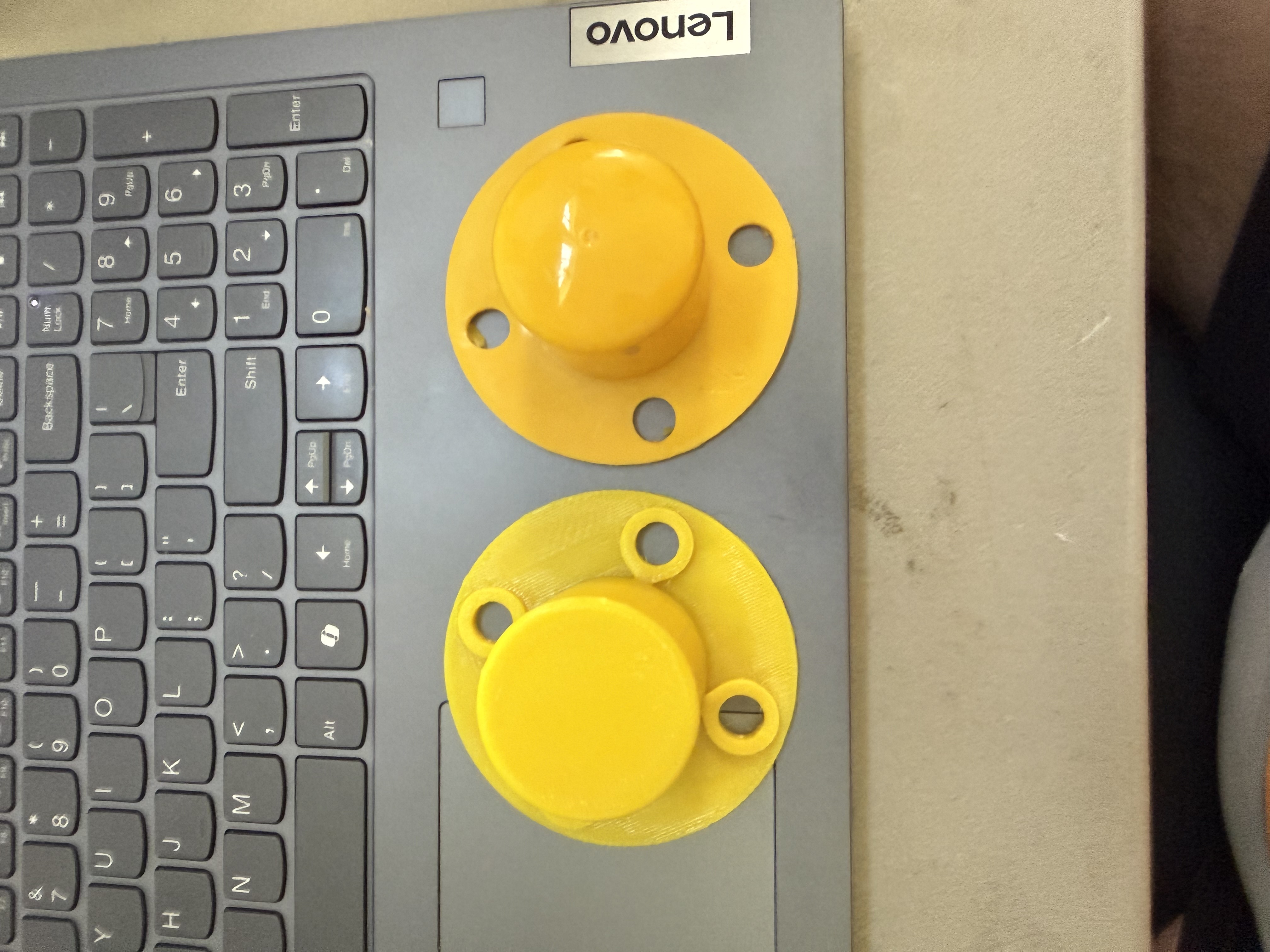 Our 3D-printed delineator cap on the left beside the original reference cap on the right.
